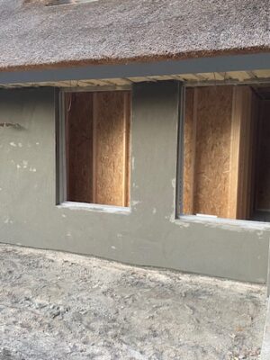 Buitenwerk cementwerk met sierpleister